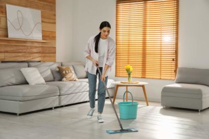 Person mopping the laminate flooring in their home