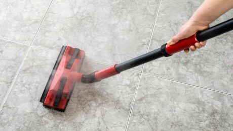 Person cleaning tile floor with a steam mop near Breese, Illinois (IL)