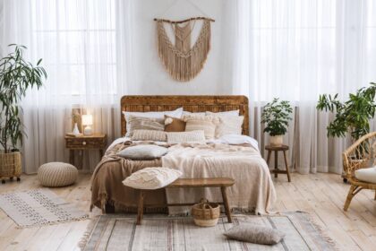 Boho interior design style with professional hardwood flooring in a light tone in a cozy bedroom at Preferred Flooring near Breese, IL