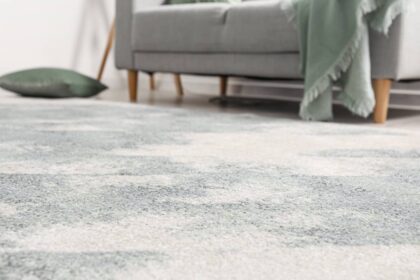 adding-resort-chic-carpet-to-your-home-1200px Resort chic carpeting in a residential living room with a couch and a throw pillow at Preferred Flooring near Breese, IL