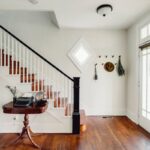 A charming entryway of a residential home with hardwood smart flooring and white walls at Preferred Flooring near Breese, IL