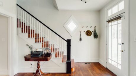 A charming entryway of a residential home with hardwood smart flooring and white walls at Preferred Flooring near Breese, IL